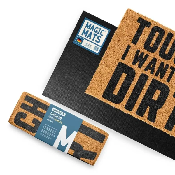Rückseite der Kokos Fußmatte mit 'TOUCH ME I WANT TO FEEL DIRTY!', aus schwarzem rutschfestem Gummi, schief und eingerollt dargestellt